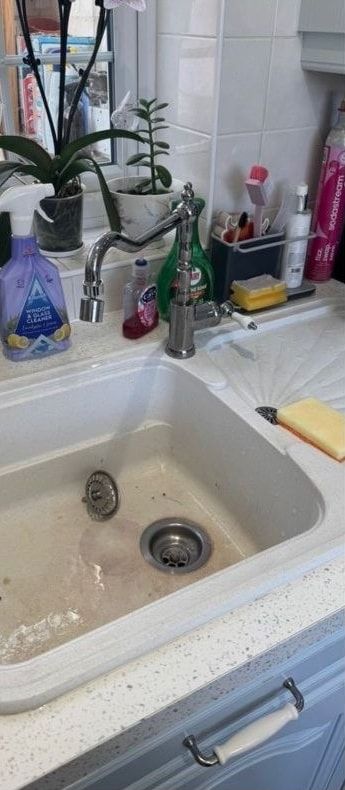 Before cleaning: cream kitchen sink and tap